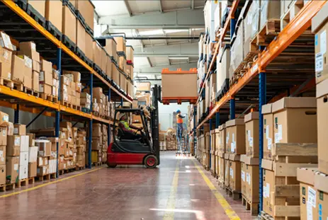 forklift rasing items in a factory